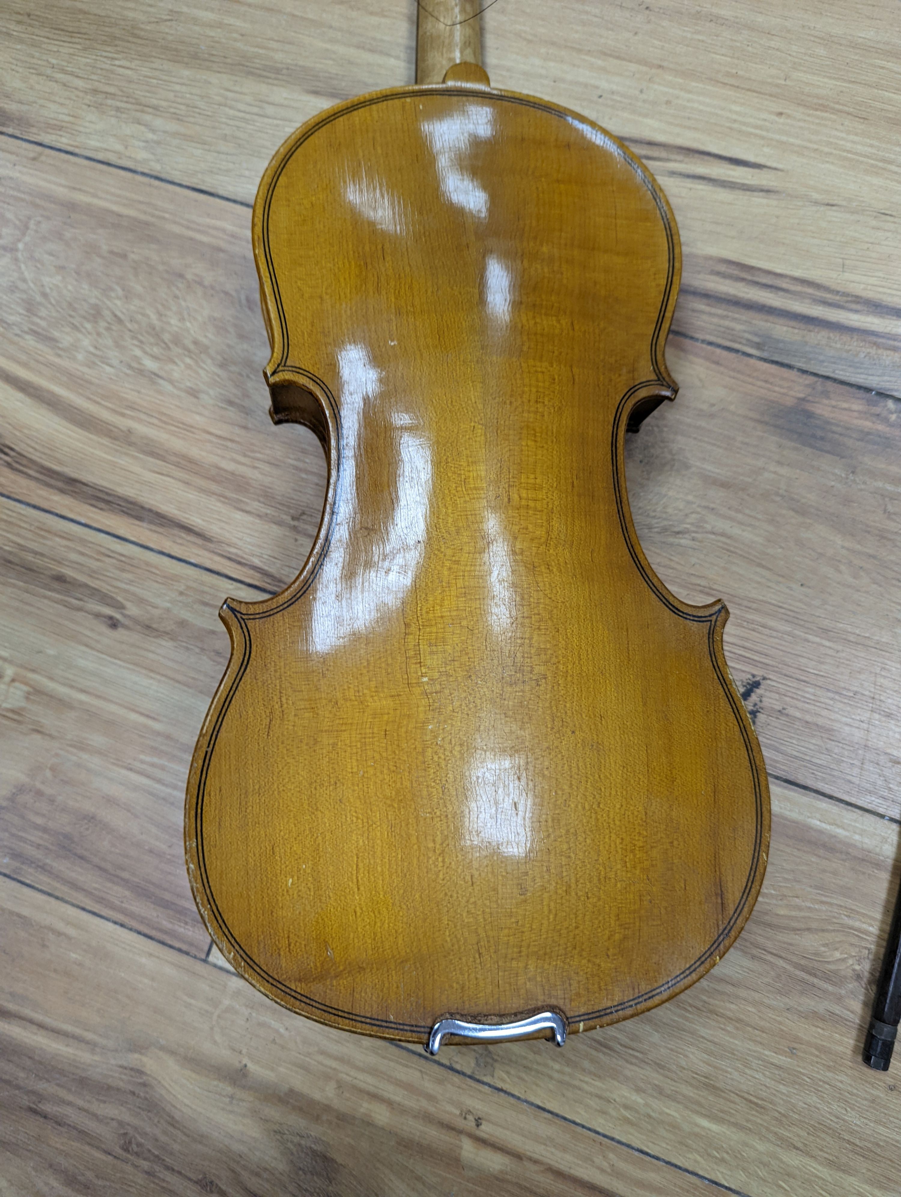 A violin and bow, various records etc